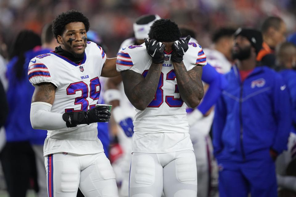 CINCINNATI, OHIO - JANUARY 02: Cam Lewis #39 and Siran Neal #33 of the Buffalo Bills react to teammate Damar Hamlin #3 collapsing after making a tackle against the Cincinnati Bengals during the first quarter at Paycor Stadium on January 02, 2023 in Cincinnati, Ohio. (Photo by Dylan Buell/Getty Images)