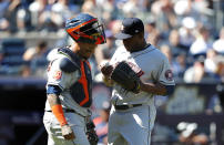 Houston Astros catcher Martin Maldonado (15) and relief pitcher Hector Neris (50) have a conference during the eighth inning of a baseball game against the New York Yankees, Saturday, June 25, 2022, in New York. (AP Photo/Noah K. Murray)