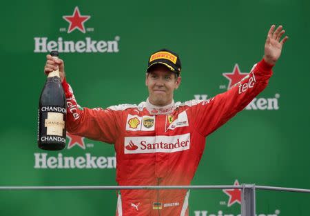 Formula One - F1 - Italian Grand Prix 2016 - Autodromo Nazionale Monza, Monza, Italy - 4/9/16 Ferrari's Sebastian Vettel celebrates third place on the podium Reuters / Max Rossi Livepic