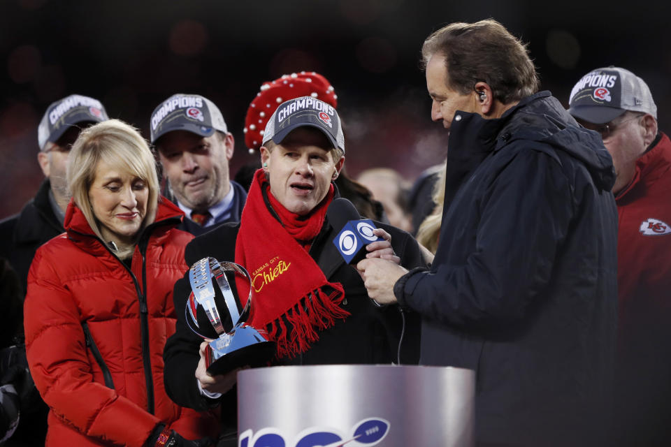 Clark Hunt, chairman and CEO of the Kansas City Chiefs, center, and his mother Norma Clark, left, speak after the NFL AFC Championship football game against the Tennessee Titans Sunday, Jan. 19, 2020, in Kansas City, MO. The Chiefs won 35-24 to advance to Super Bowl 54. (AP Photo/Charlie Neibergall)