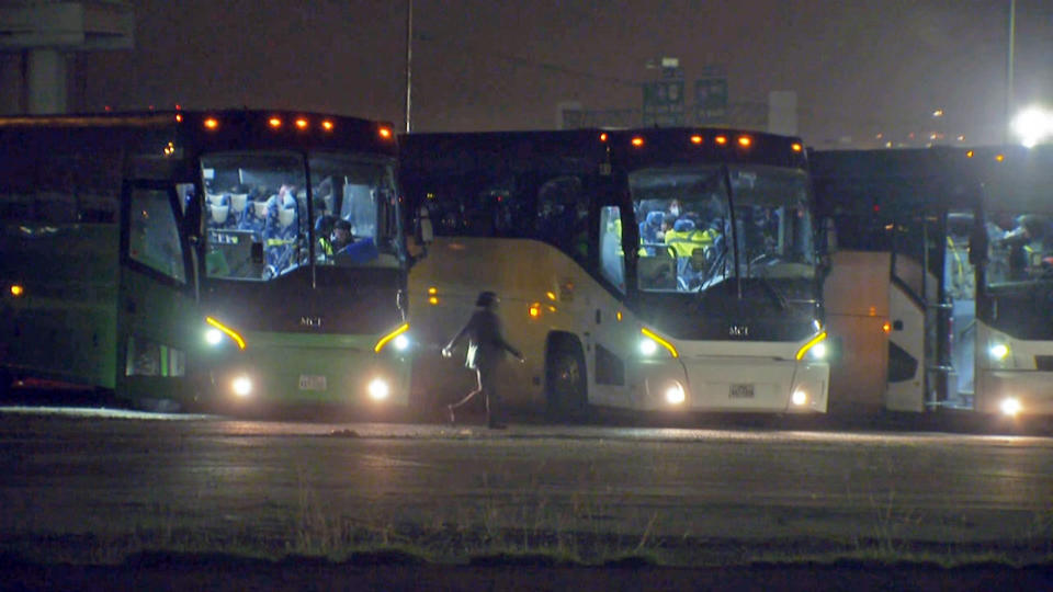 Passenger buses parked outside Kay Bailey Hutchison Convention Center Dallas. According to family of one of the passengers inside, the buses were full of migrant children who had been waiting on board several days to be transferred from Health and Human Services (HHS) custody to sponsors and family members. (NBC News)