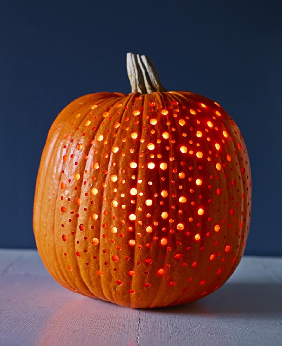 <p>It may <em>look</em> elaborate, but this polka-dot pattern is fairly easy. Sketch your pattern with a marker, leaving enough space between dots so holes won't overlap. Punch it out with a power drill and various bits. Finish it off by placing LED string lights inside to bask in your handiwork's glow. </p><p><a class="link " href="https://www.amazon.com/Tesyker-Fairy-Lights-Multicolor-Waterproof/dp/B07C3N6KMF/?tag=syn-yahoo-20&ascsubtag=%5Bartid%7C10055.g.238%5Bsrc%7Cyahoo-us" rel="nofollow noopener" target="_blank" data-ylk="slk:SHOP STRING LIGHTS;elm:context_link;itc:0;sec:content-canvas">SHOP STRING LIGHTS</a></p>
