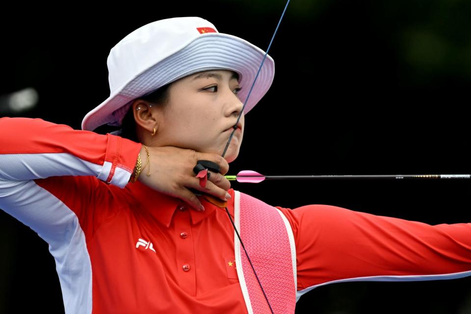 <span>La atleta china Li Jiaman durante la ronda preliminar de tiro con arco durante los Juegos Olímpicos de París, el 25 de julio de 2024 </span><div><span>Punit PARANJPE</span><span>AFP</span></div>