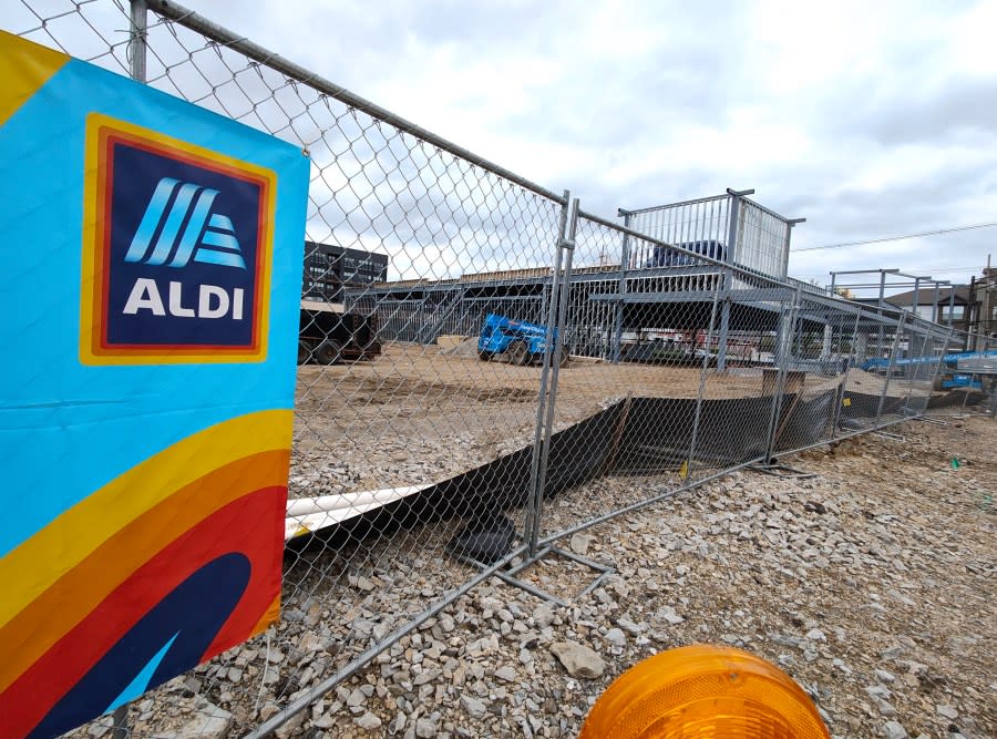 A sign advertises a coming Aldi store in front of a construction site at 1393 Edgehill Rd. (NBC4 Photo/Mark Feuerborn)