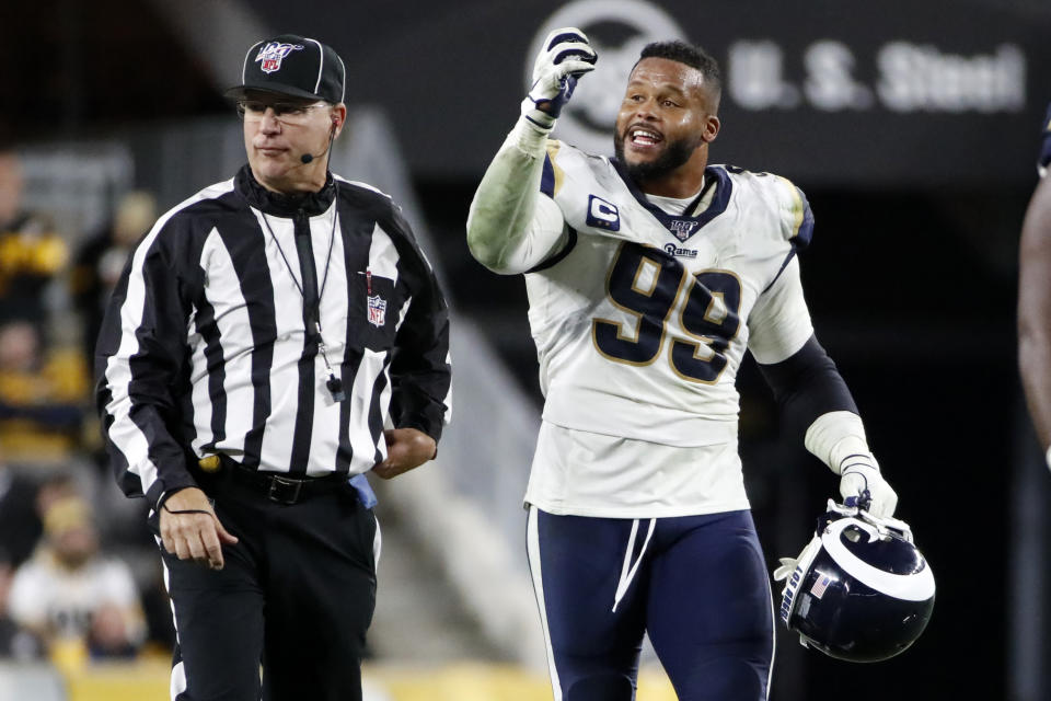 Los Angeles Rams defensive tackle Aaron Donald (99) makes his case to an official during the second half of an NFL football game against the Pittsburgh Steelers in Pittsburgh, Sunday, Nov. 10, 2019. (AP Photo/Don Wright)