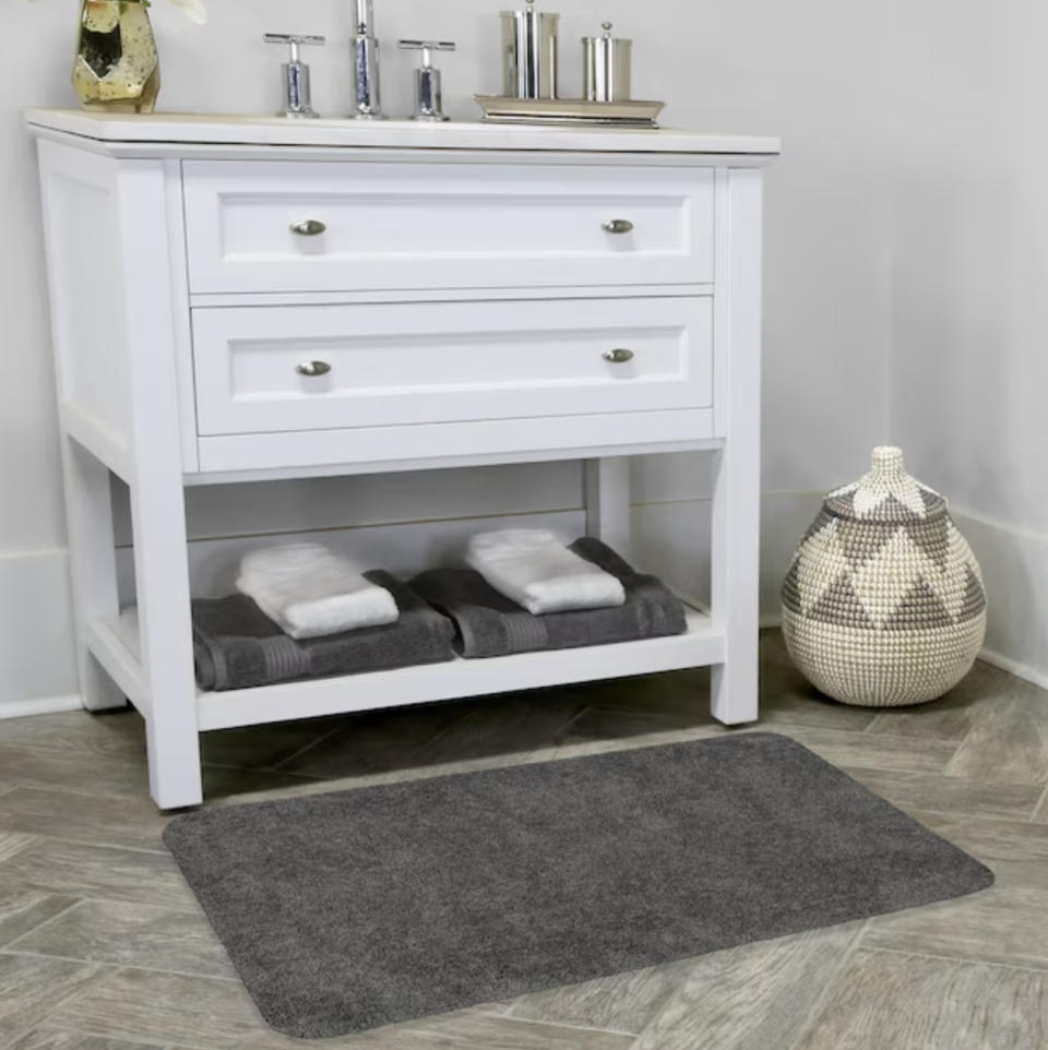 bath rug on display in front of sink vanity