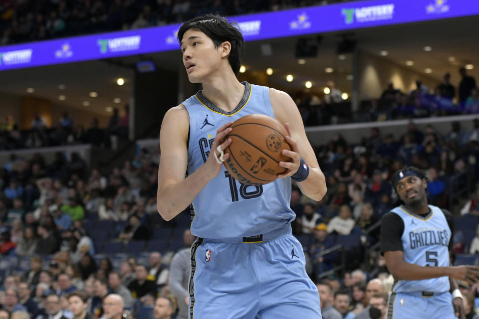 Memphis Grizzlies forward Yuta Watanabe (18) controls the ball n the first half of an NBA basketball game against the New Orleans Pelicans, Monday, Feb. 12, 2024, in Memphis, Tenn. (AP Photo/Brandon Dill)