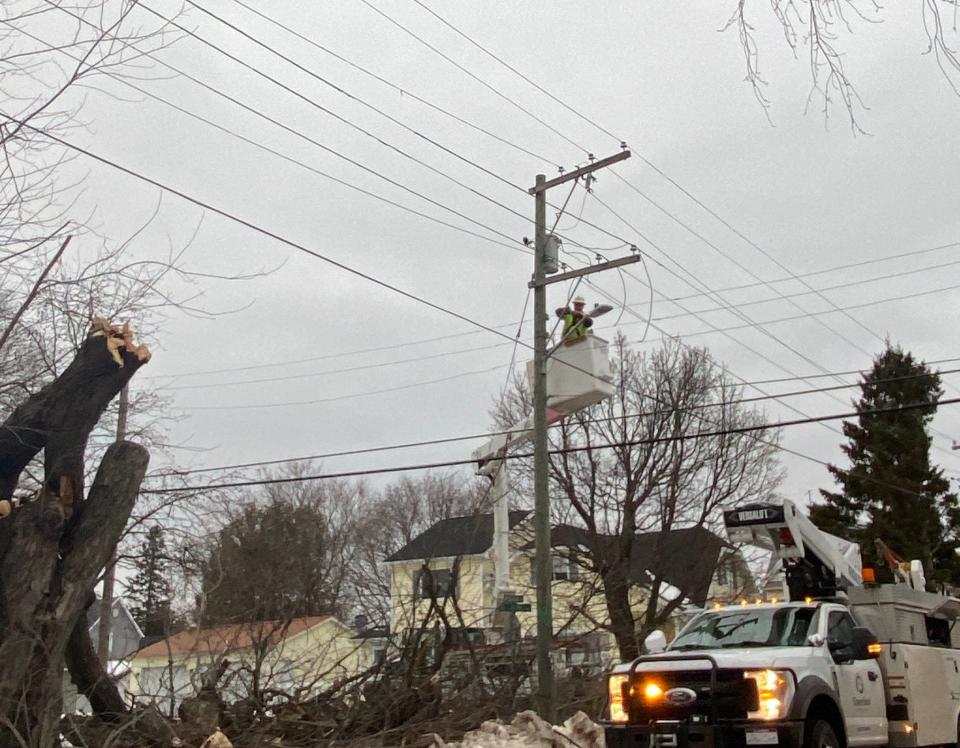 Crews work around the clock to address broken poles and trees on power lines.