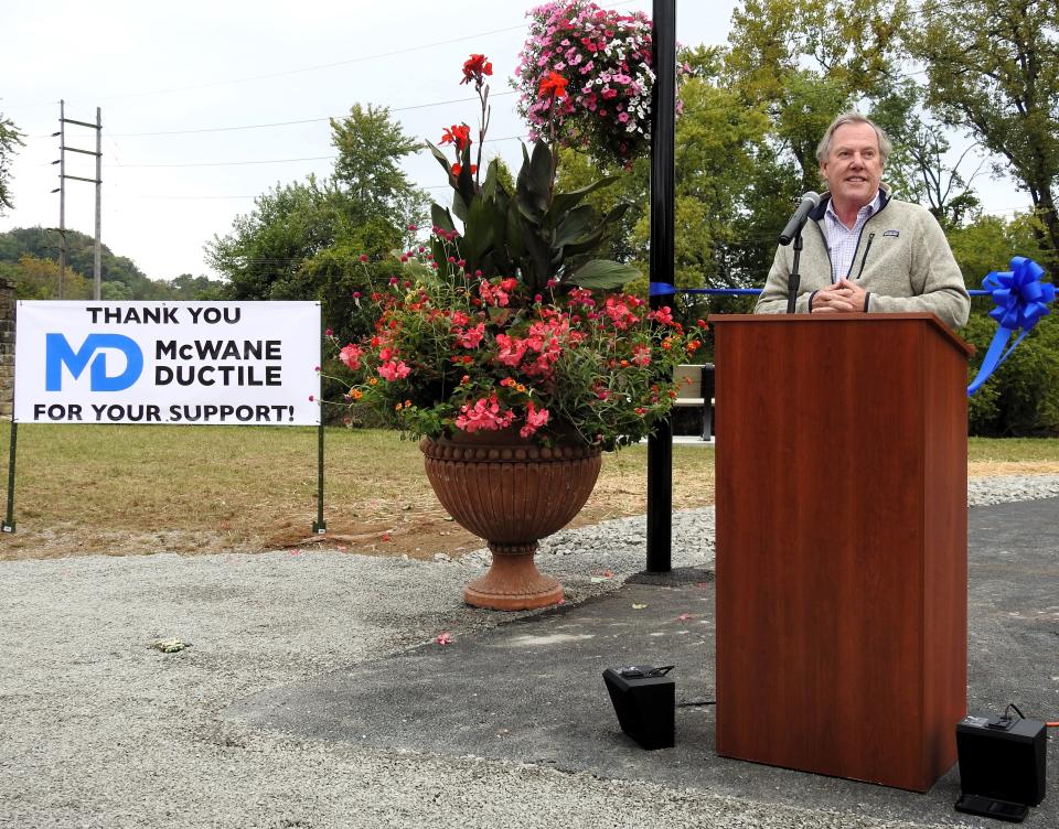 Philip McWane of McWane Ductile speaks at a ribbon cutting for the new McWane River Walk funded by a $500,000 donation from the company.