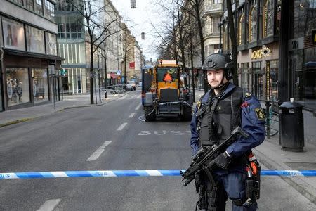 STOCKHOLM 2017-04-08 Police in central Stockholm in the area of the crime scene on April 08, 2017, the day after a hijacked beer truck plowed into pedestrians on Drottninggatan and crashed into Ahlens department store on Friday, killing four people, injuring 15 others. TT News Agency/Anders Wiklund/via REUTERS