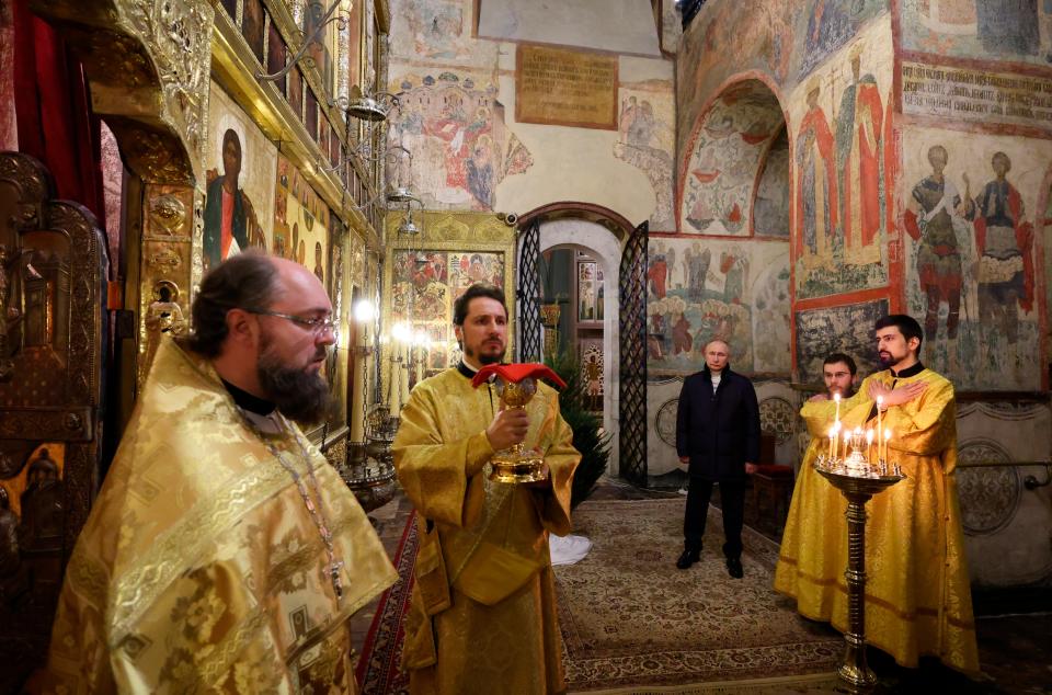 Russian president Vladimir Putin, background center, attends the Christmas service at the Annunciation Cathedral in the Moscow Kremlin in Moscow, Russia, Saturday, 7 January 2023 (AP)