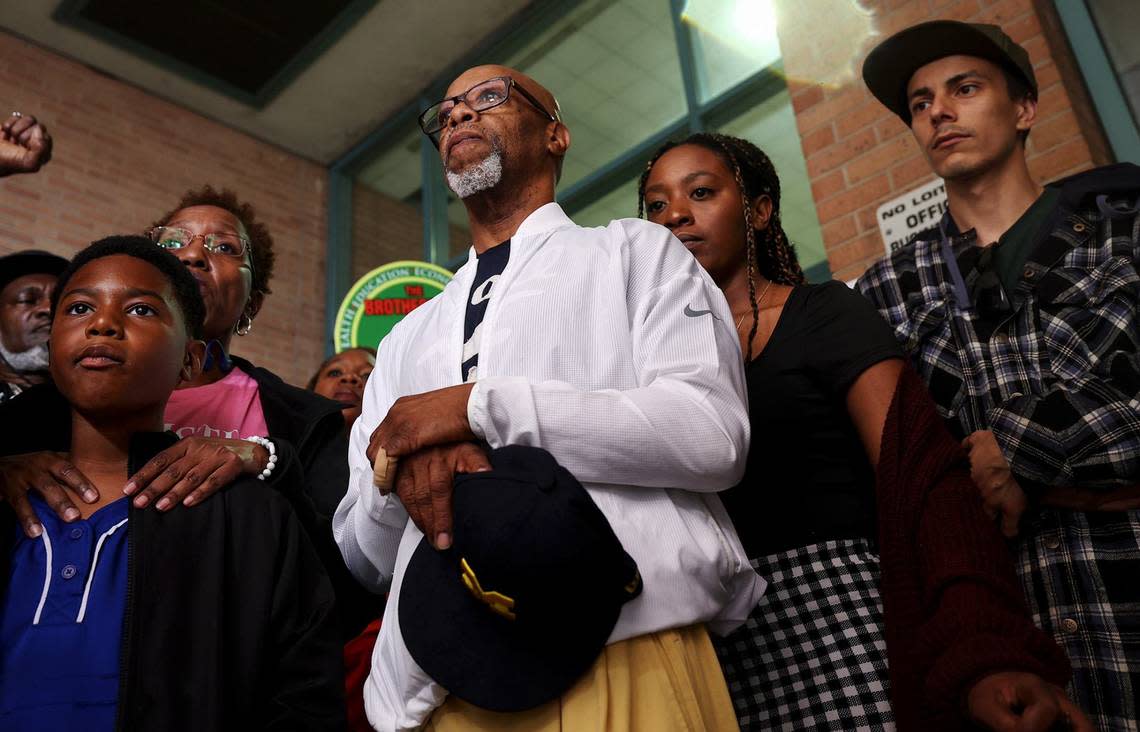 Anthony Johnson, Sr., center, stands with family members outside of the Tarrant County Jail to demand the release of the full video of his son’s death on Thursday, May 30, 2024, in downtown Fort Worth. Anthony Johnson Jr. was killed while in custody at the Tarrant County Jail in April.