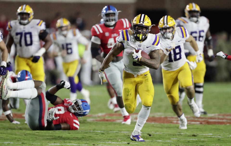 LSU running back Derrius Guice (5) took time out of his day to make Christmas especially memorable for one fan. (AP Photo/Rogelio V. Solis)