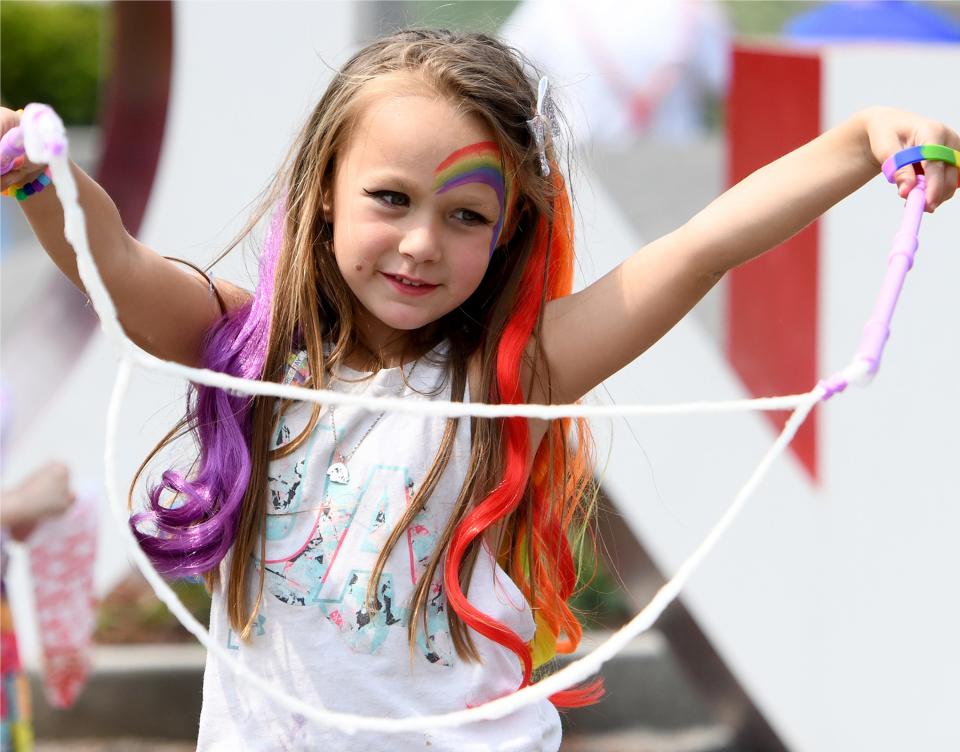 Charlie Batdorff joined her parents, Sarah and Al Batdorff, for the fun at the Stark Pride Festival in downtown Canton on Saturday.