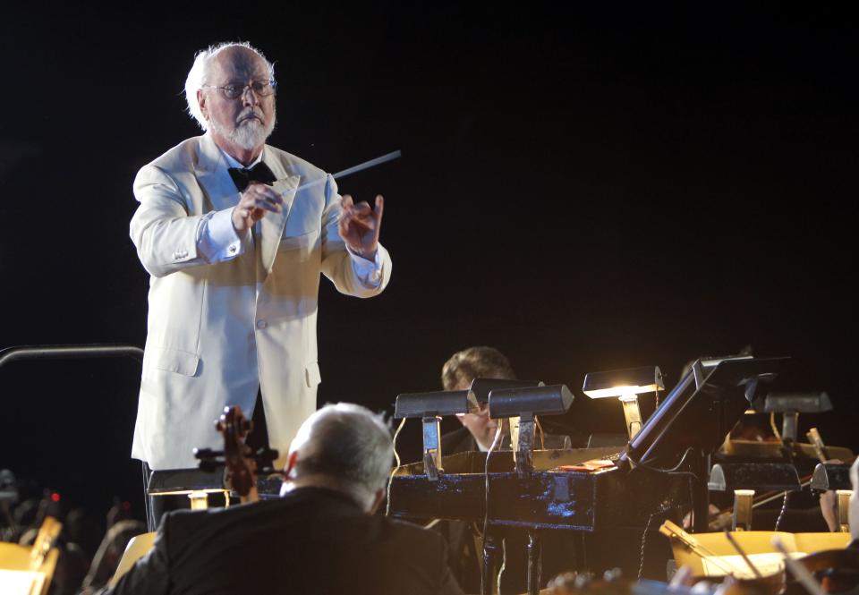 John Williams Composer and conductor John Williams leads the Orlando Philharmonic Orchestra during the grand opening celebration at the Wizarding World of Harry Potter at Universal Orlando Resort theme park in Orlando, Fla., . Williams has composed many film scores, including Star Wars, Superman, Home Alone, the first three Harry Potter movies and many Steven Spielberg's feature films including the Indiana Jones series, Schindler's List, E.T. the Extra-Terrestrial, Jurassic Park and JawsHarry Potter Park, Orlando, USA