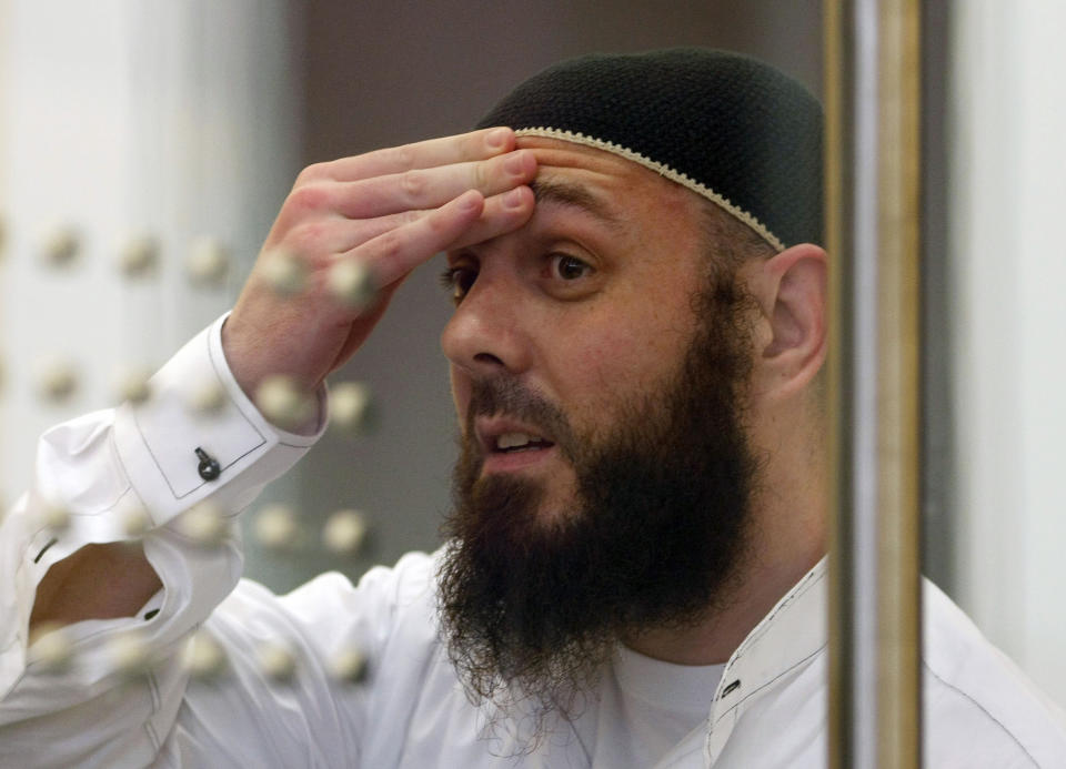 FILE - In this Tuesday Aug 11, 2009 file photo, defendant Adem Yilmaz reacts in a courtroom in Duesseldorf, western Germany. A German court says it had no option but to reject an American request for the extradition of the Turkish man wanted in the United States on terrorism charges. Yilmaz finished serving his sentence in October, stemming from a foiled plot to attack U.S. targets in Germany. (Ina Fassbender/ Pool via AP)