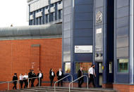 Prison workers enter HMP Birmingham after the British government took over its running from G4S, in Birmingham, Britain August 20, 2018. REUTERS/Darren Staples