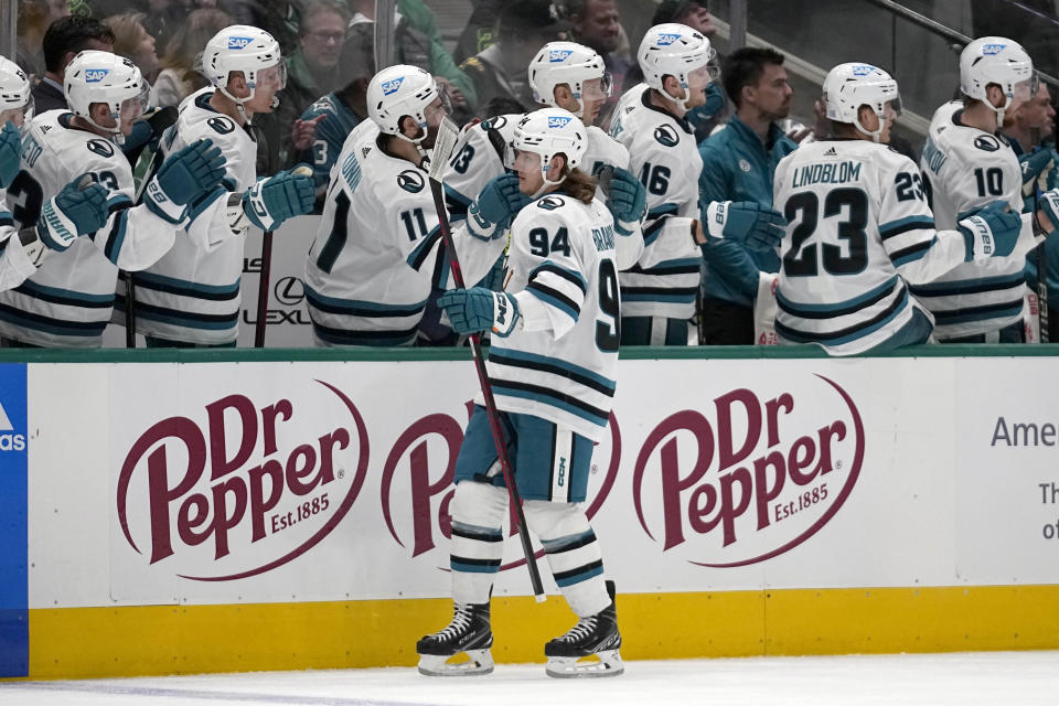 San Jose Sharks left wing Alexander Barabanov (94) celebrates with the bench after scoring against the Dallas Stars in the first period of an NHL hockey game in Dallas, Friday, Nov. 11, 2022. (AP Photo/Tony Gutierrez)