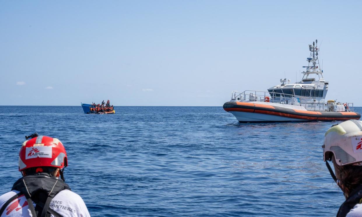 <span>MSF volunteers look on during the incident on Saturday. </span><span>Photograph: Simone Boccaccio/Sopa Images/Rex/Shutterstock</span>