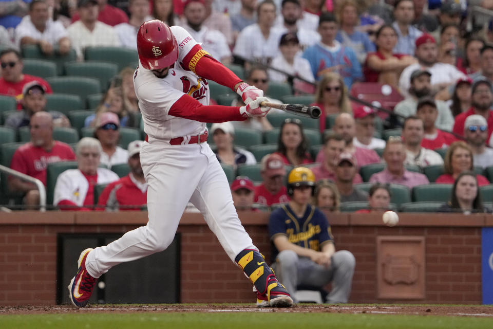 St. Louis Cardinals' Nolan Arenado hits an RBI single during the first inning of a baseball game against the Milwaukee Brewers Wednesday, May 17, 2023, in St. Louis. (AP Photo/Jeff Roberson)