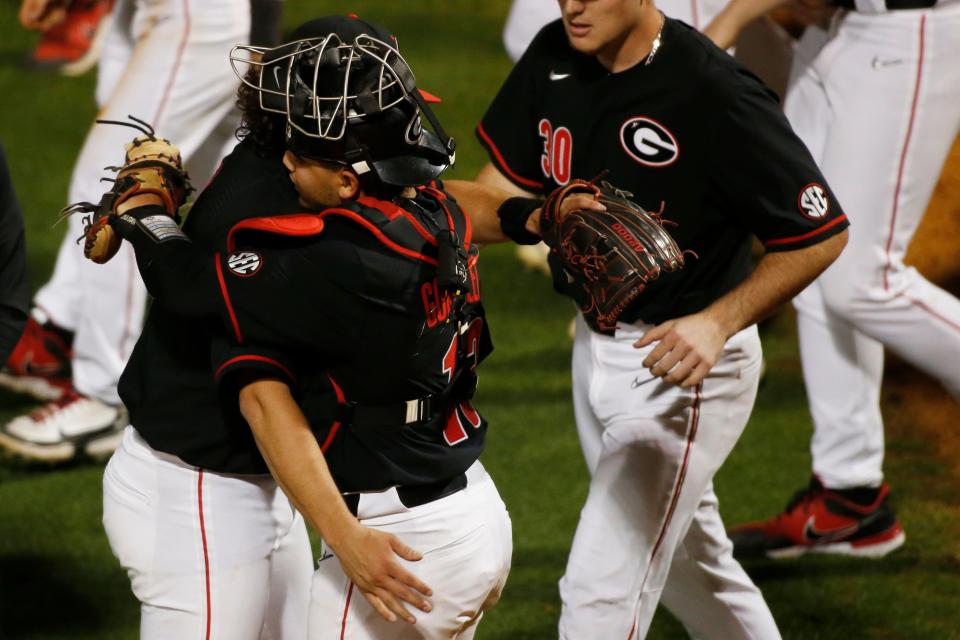 Georgia pitcher Jack Gowen (31) celebrates with his teammates after getting a final out to end the game during an NCAA baseball game between Florida and Georgia in Athens, Ga., on Apr. 1, 2022. Georgia won 6-1.<br>News Joshua L Jones