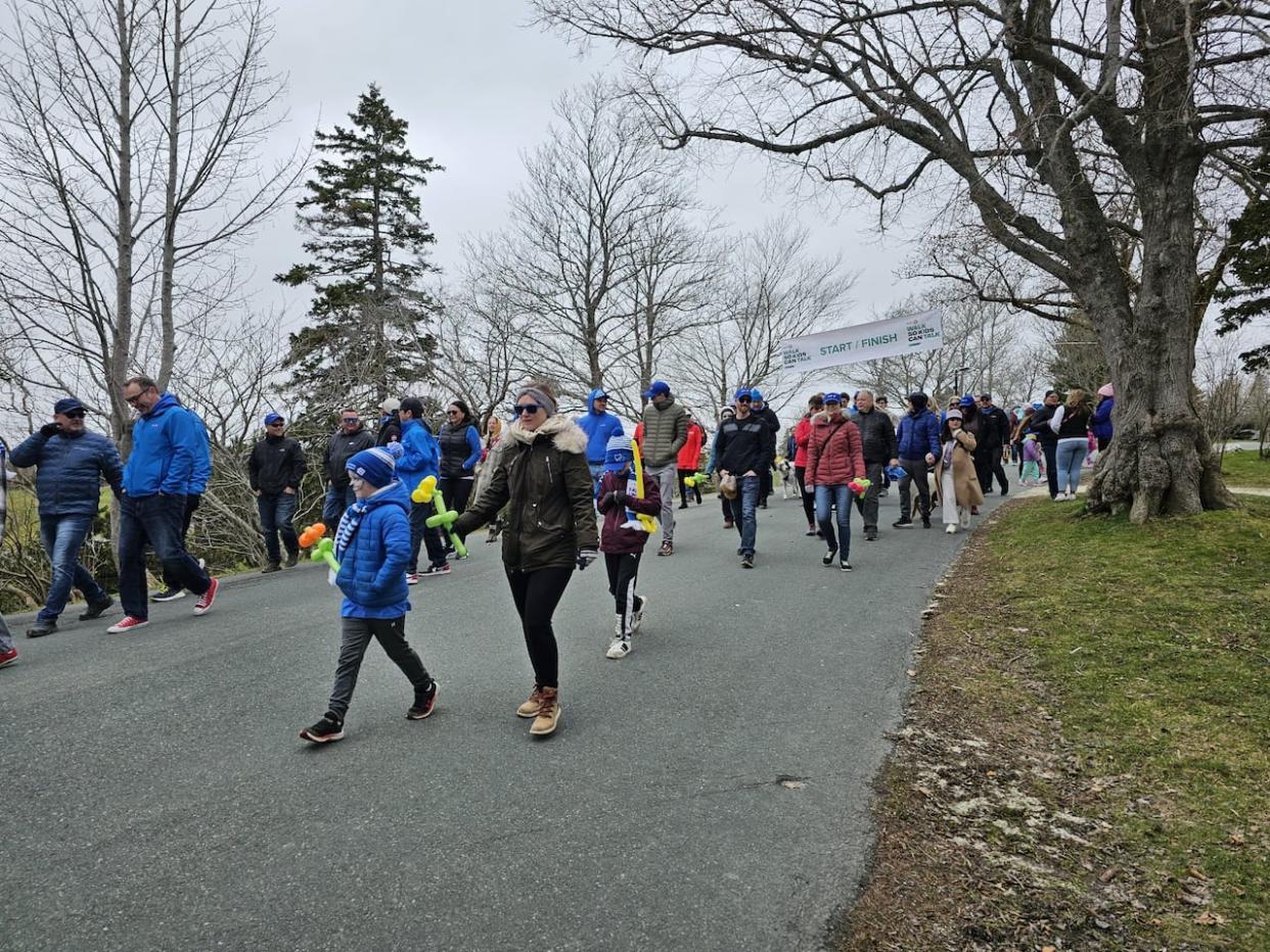 Sunday at Bowring Park in St. John's brought dozens of adults and children for a walk aimed at raising awareness for youth mental health and specifically to raise funds to the non-profit organization Kids Phone Help. Similar walks happened that day across Canada. (Arlette Lazarenko/CBC - image credit)