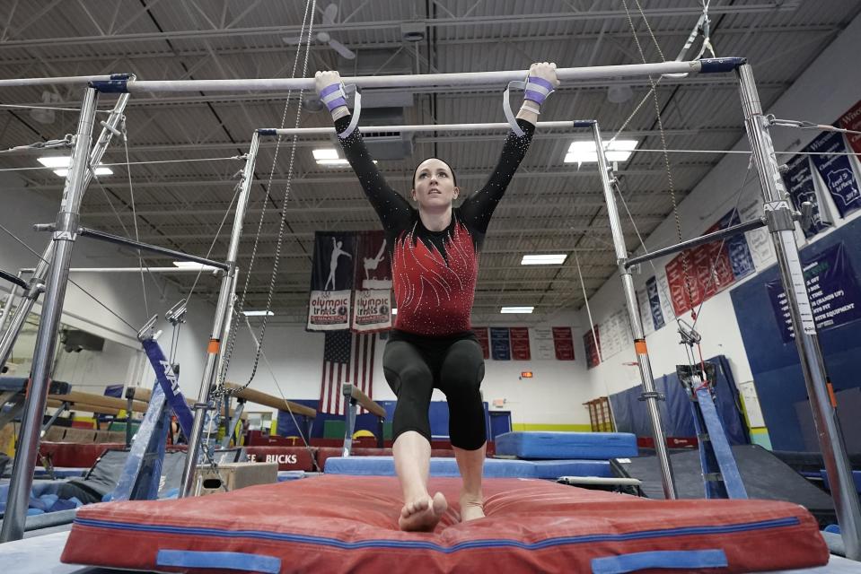 FILE - In this Feb. 18, 2021, file photo, gymnist Chellsie Memmel trains in New Berlin, Wis. The 32-year-old Memmel, a former world champion and Olympic silver medalist, will compete for the first time in nine years on Saturday at the US Classic in Indianapolis. (AP Photo/Morry Gash, File)