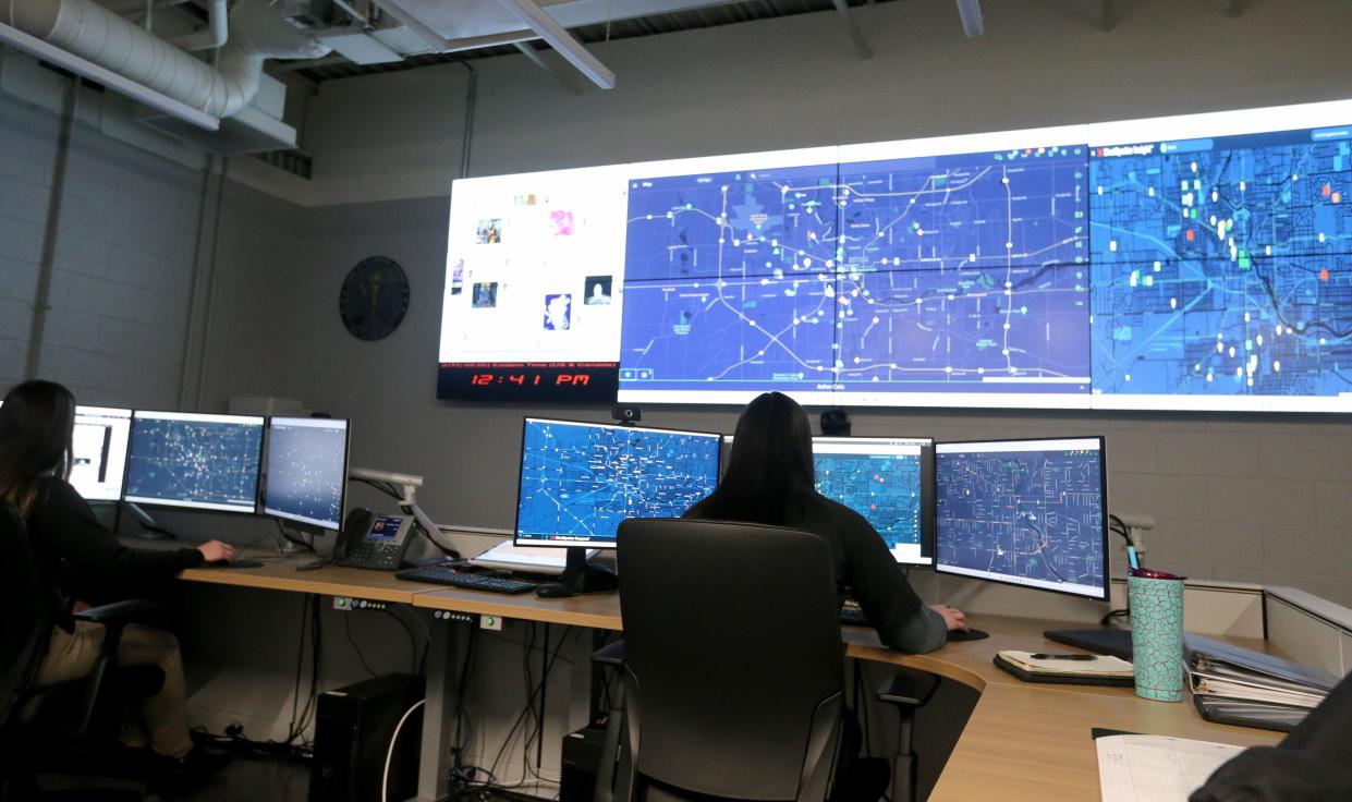 Crime analysts sit at their consoles Tuesday, Feb. 21, 2023, in the South Bend Police Department’s new Real Time Crime Center in the central police station.