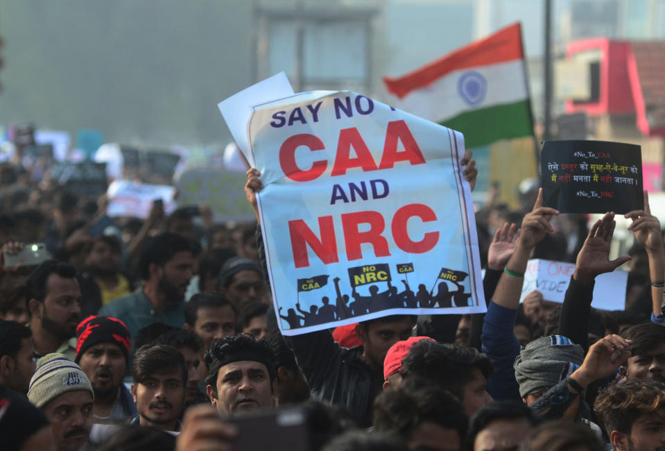 Protesters shout with placards during a demonstration against India's new citizenship law CAA ( Citizenship amandment Act ) in Allahabad on December 19,2019 . Indians defied bans nationwide as anger swells against a citizenship law seen as discriminatory against muslims, following days of protest, clashes, and riots that have left six dead .(Photo by Ritesh Shukla/NurPhoto via Getty Images)