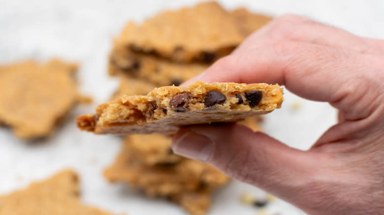 chocolate chip cookie brittle with hand