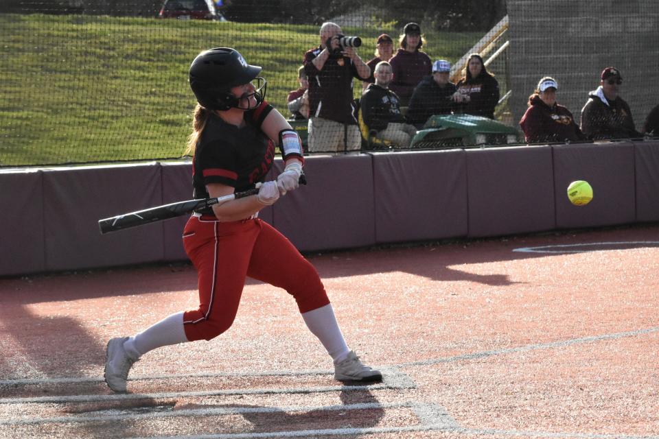 Mallory Shelton prepares to lay into a pitch against Bloomington North.