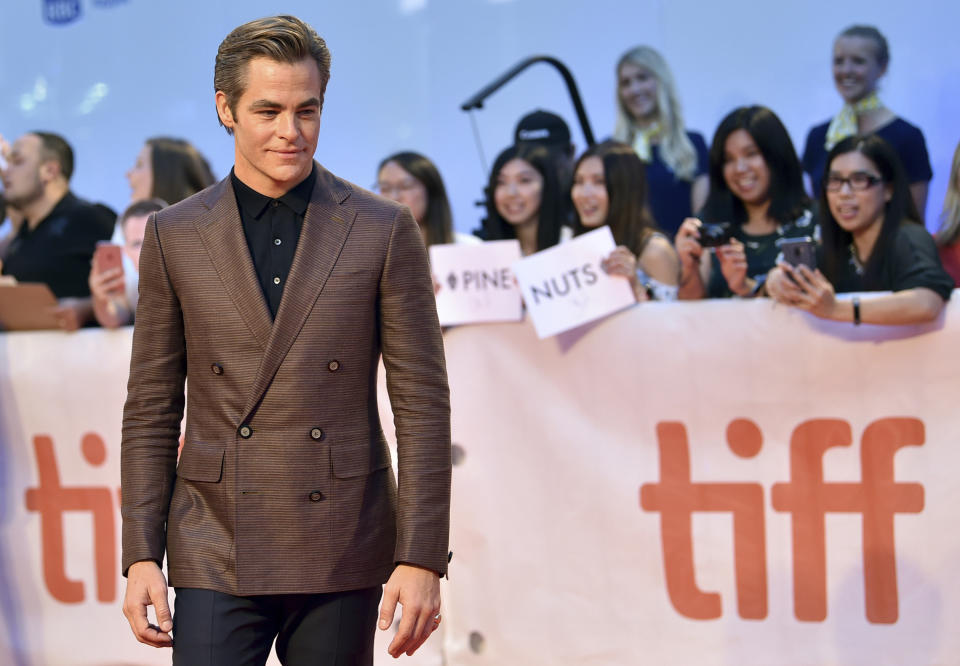 FILE - Chris Pine attends the gala for "Outlaw King" as his fans carry a "Pine Nuts" sign on day 1 of the Toronto International Film Festival on Sept. 6, 2018, in Toronto. Pine turns 40 on Aug. 26. (Photo by Evan Agostini/Invision/AP, File)