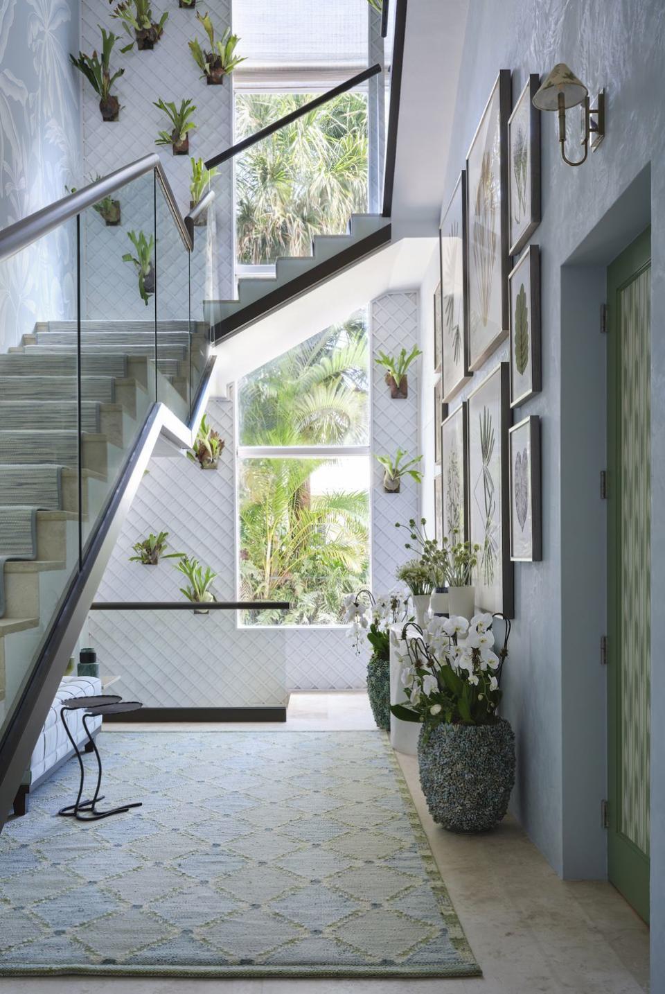 a staircase with potted plants