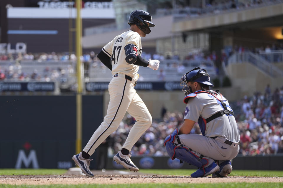 Minnesota Twins' Edouard Julien crosses home plate after hitting a solo home run during the during the fifth inning of a baseball game against the Los Angeles Dodgers, Wednesday, April 10, 2024, in Minneapolis. (AP Photo/Abbie Parr)