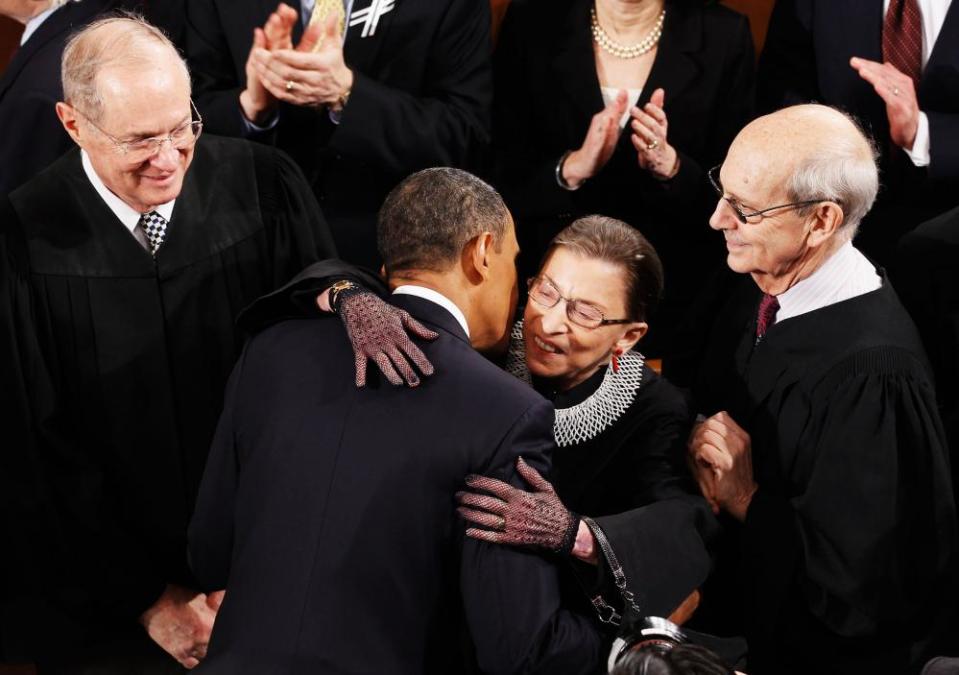 Ruth Bader Ginsburg embracing Barack Obama before his State of the Union address in 2011, with fellow supreme court justices Anthony Kennedy, left, and Stephen Breyer.