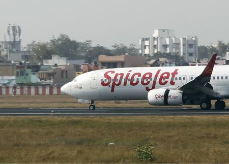 FILE PHOTO - A SpiceJet passenger plane moves on the runway at the Sardar Vallabhbhai Patel international airport in the western Indian city of Ahmedabad January 8, 2014. REUTERS/Amit Dave