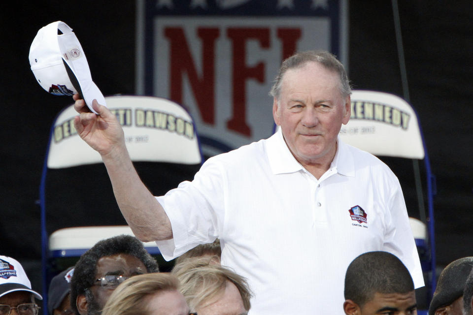 FILE - In this Aug. 4, 2012 file photo, Pro Football Hall of Fame member Len Dawson is introduced during the induction ceremony at the Pro Football Hall of Fame in Canton, Ohio. Dawson, who helped the Kansas City Chiefs to a Super Bowl title, died Wednesday, Aug. 24, 2022. He was 87. (AP Photo/Tom E. Puskar, File)