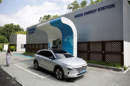 A Hyundai Motor's Nexo hydrogen car is fuelled at a hydrogen station in Seoul