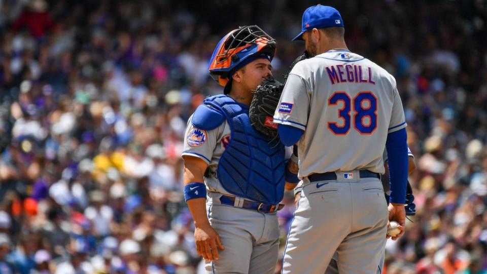 May 28, 2023; Denver, Colorado, USA; New York Mets catcher Francisco Alvarez (4) pays a visit to New York Mets starting pitcher Tylor Megill (38) on the mound in the fourth inning against the Colorado Rockies at Coors Field.