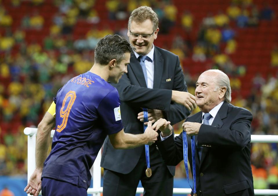 FIFA President presents a medal to Robin van Persie of the Netherlands after the 2014 World Cup third-place playoff between Brazil and the Netherlands at the Brasilia national stadium in Brasilia July 12, 2014. REUTERS/Jorge Silva (BRAZIL - Tags: SOCCER SPORT WORLD CUP)