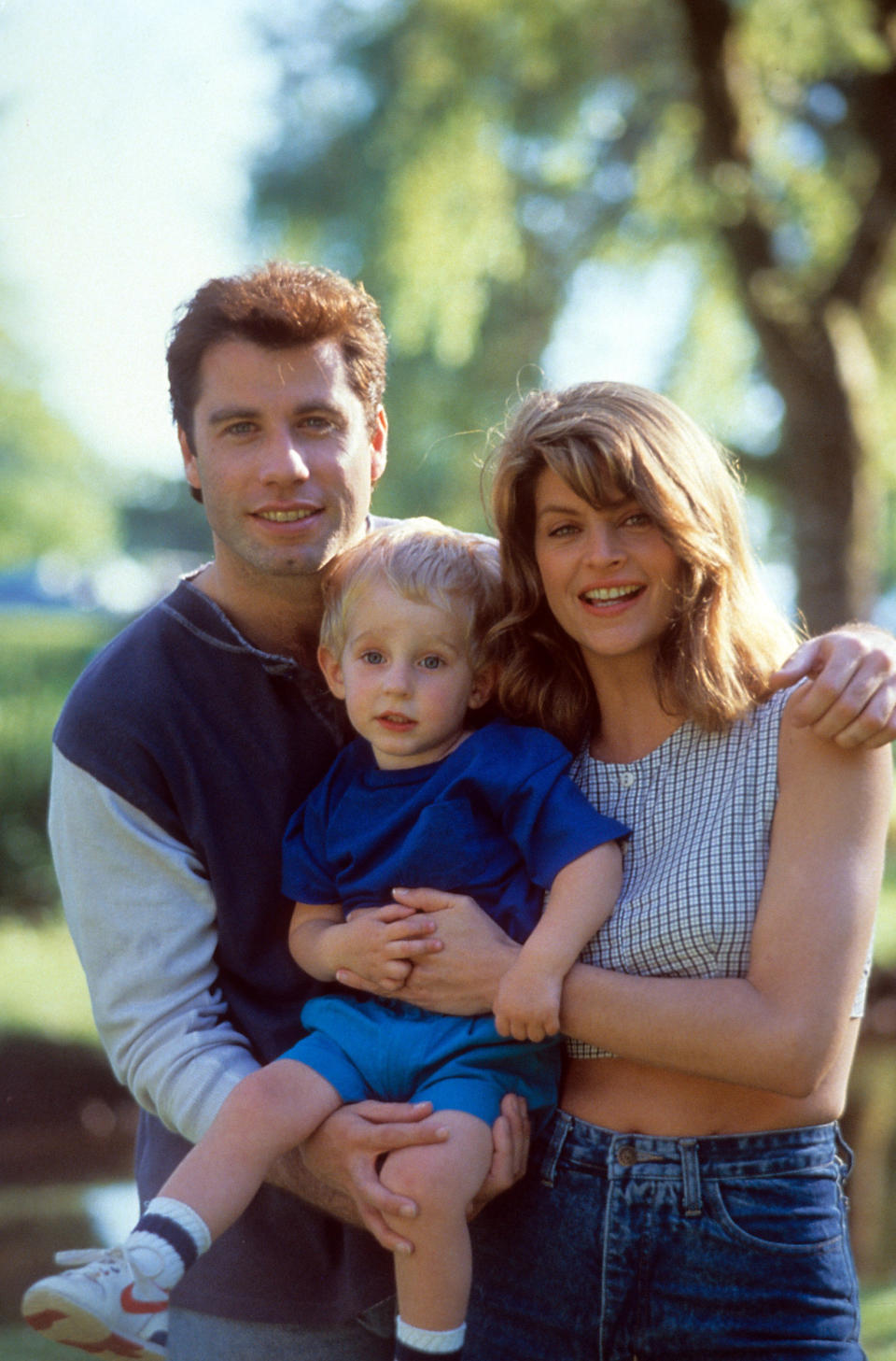 The actors holding a child in a scene from the film 