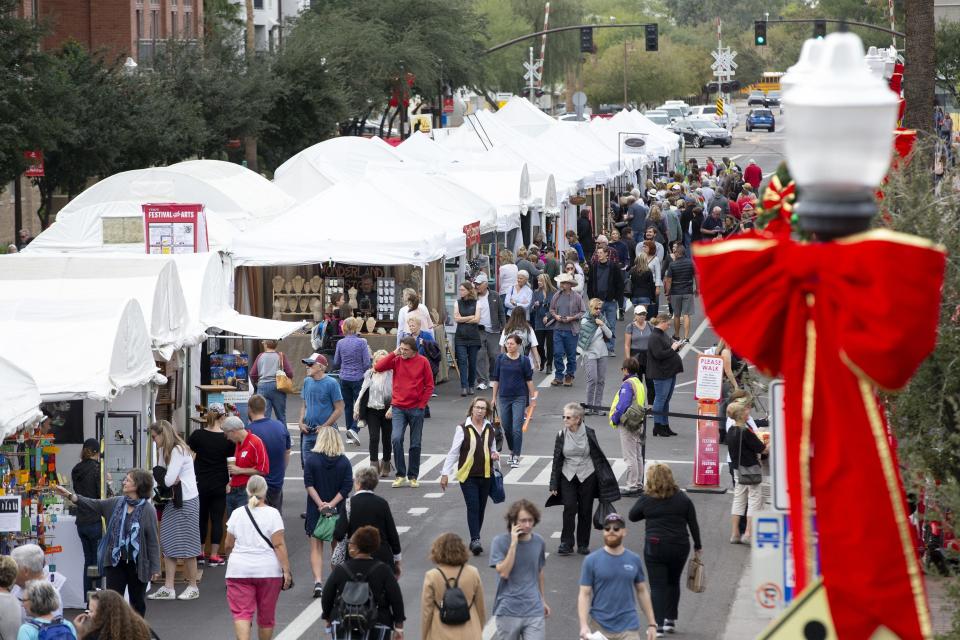 Shoppers look for goods during the Tempe Arts Festival on Dec. 6, 2019. The festival runs through the weekend.