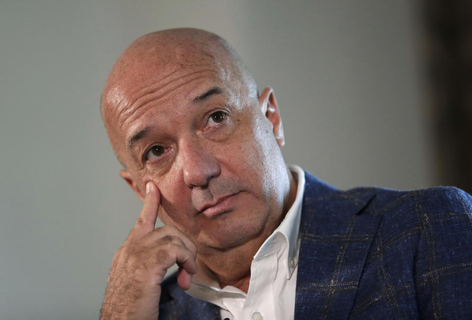 In this June 23, 2019 photo, Ivan Simonovis listens during an interview with The Associated Press, in Miami. In his first interview from exile in the U.S., Simonovis, the former police commissioner whose about 15-year detention became an opposition rallying cry, shares details of his movie-like breakout. (AP Photo/Lynne Sladky)