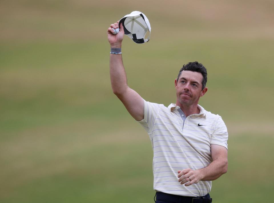 Rory McIlroy salutes the crowd at St Andrews (REUTERS)