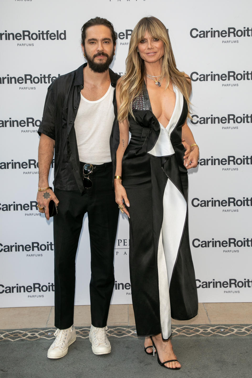 Tom Kaulitz and Heidi Klum attend the Carine Roitfeld Parfums "7 lovers" : Cocktail At The Peninsula Hotel In Paris on July 01, 2019 in Paris