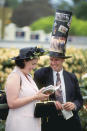 Spectators and their hats enjoy the day out during the Melbourne Cup. Nice hat, guy.