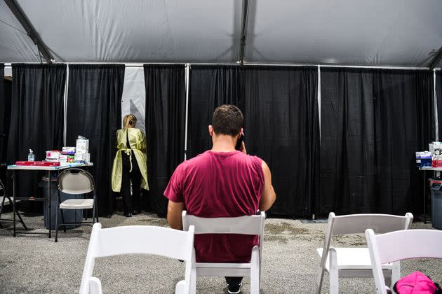 Above, a patient waits for treatment inside the Regeneron Clinic at a monoclonal antibody site in Pembroke Pines, Florida. (Photo: CHANDAN KHANNA via Getty Images)