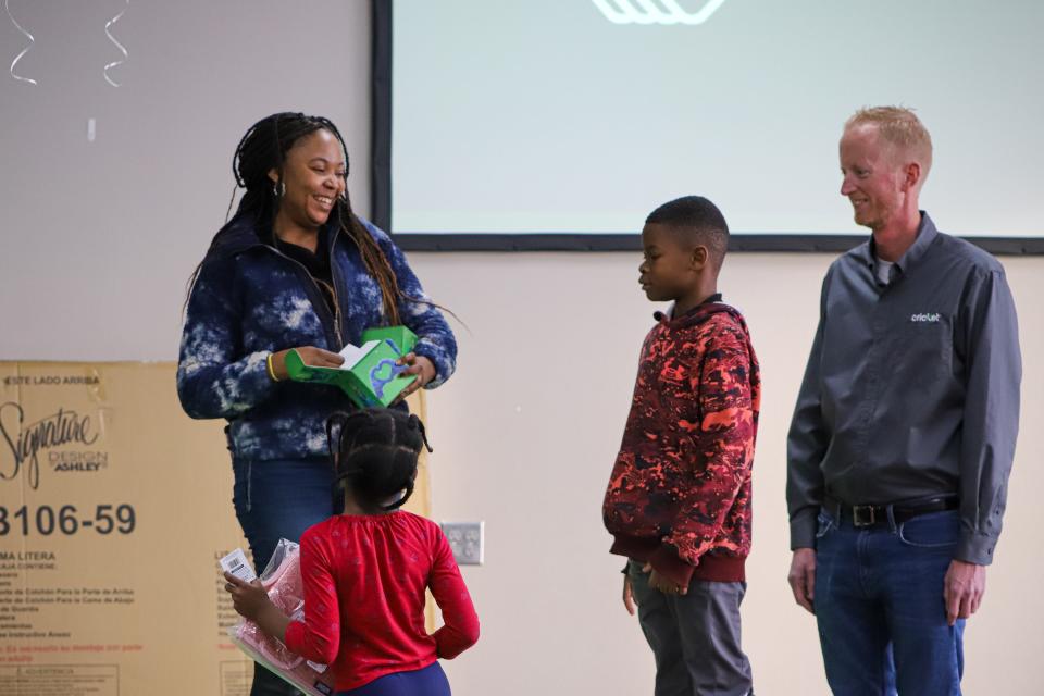 Angel Charma and her two children, who attend the Boys & Girls Clubs in Sioux Falls, were chosen to receive gifts as part of Cricket Wireless' 12 Days of Cricket campaign on Tuesday, Nov. 29.