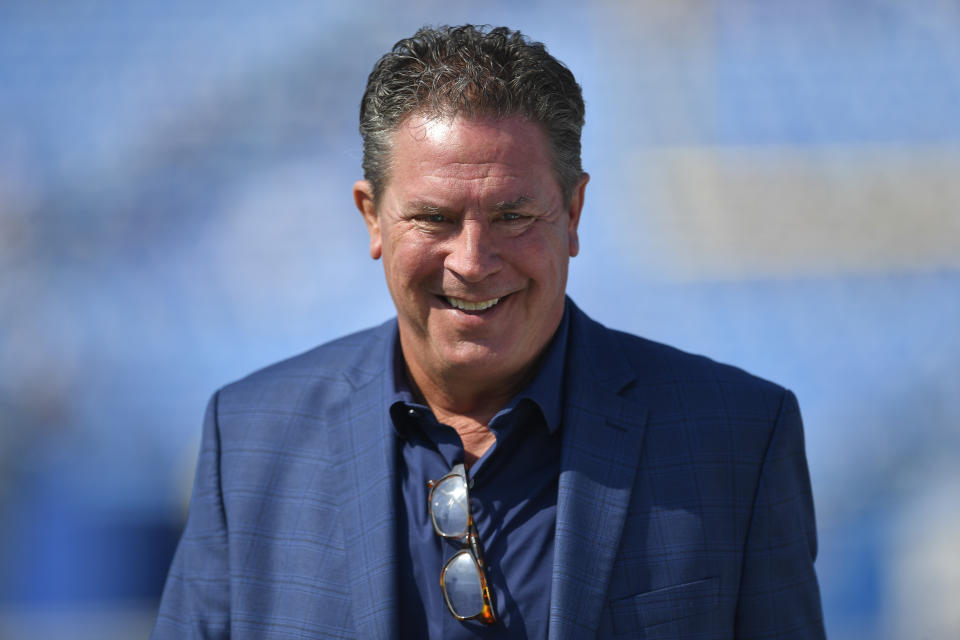 FILE - Former Miami Dolphins quarterback Dan Marino watches warm ups before an NFL football game against the Buffalo Bills in Orchard Park, N.Y., Oct. 1, 2023. Marino and actress Scarlett Johansson will star in the Super Bowl commercial that will focus on M&Ms candy being the comfort fun food while watching the big game. (AP Photo/Adrian Kraus, File)