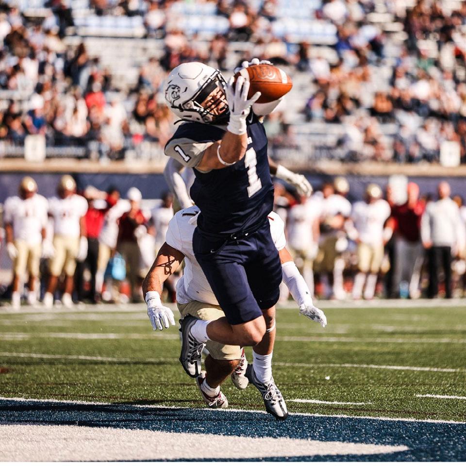 UNH"s Sean Coyne hauls in a touchdown in a game earlier this season against Elon. The Wildcats will host URI on Saturday at Wildcat Stadium. Kickoff is scheduled for 1 p.m.